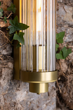 Retro bathroom wall light in gold cylinder and glass Louise. Mullan. 