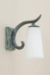 Delia small wall lamp in green patinated bronze. Objet insolite. 