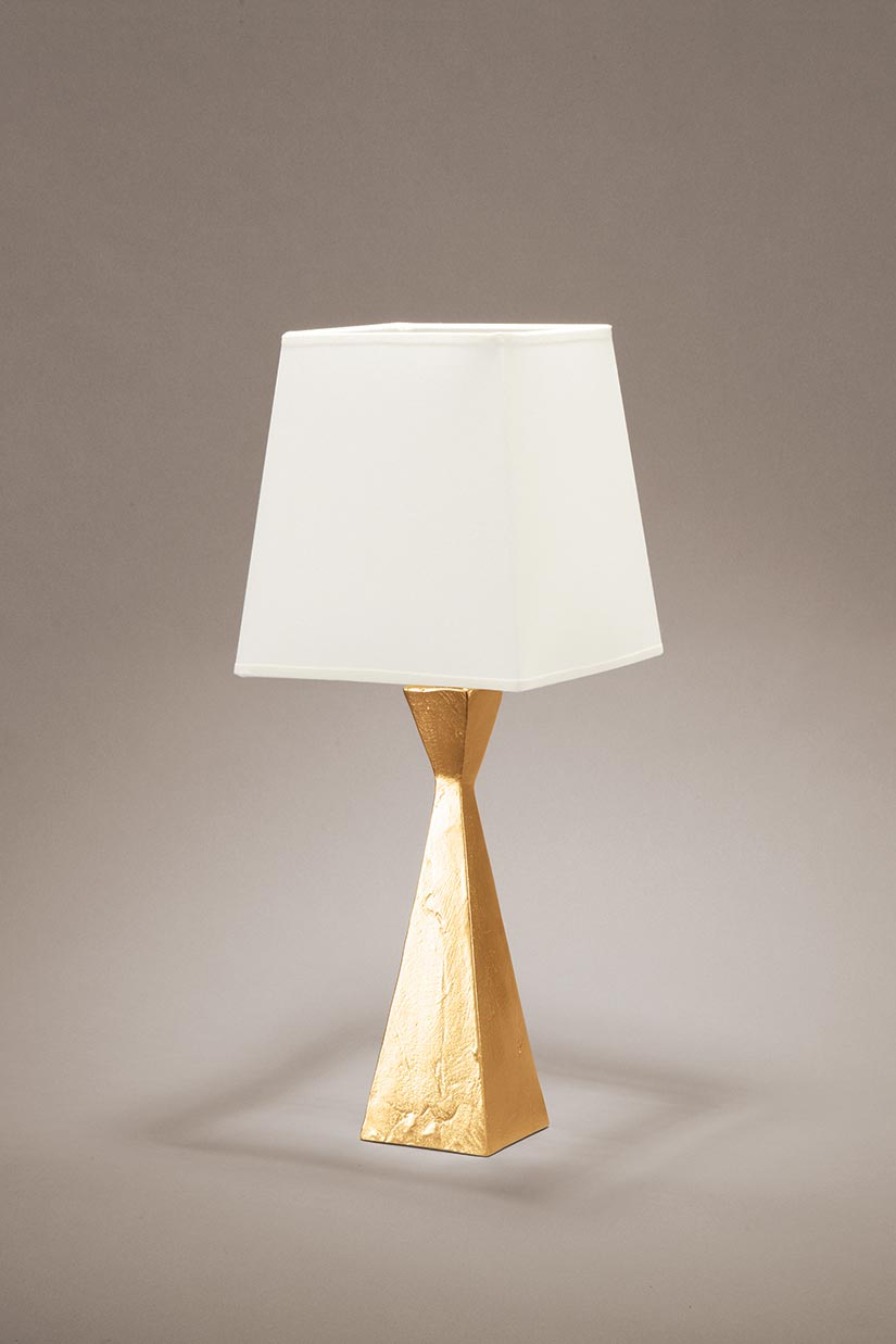 Pablo small table lamp with hourglass shape base and gold finish. Objet insolite. 