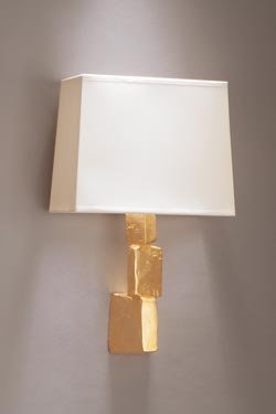 Fragile wall light with stack of gilded bronze stones. Objet insolite. 