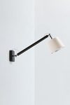 Applique orientable noire de la collection Joint. Paulo Coelho. 