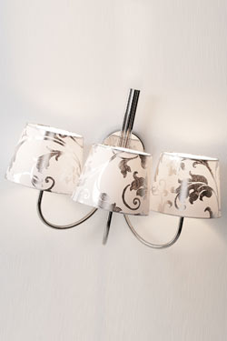 Camber Cromado baroque applique triple. Paulo Coelho. 
