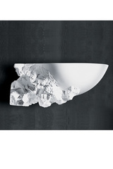 Carved natural plaster wall lamp on the left side. Sedap. Carved natural plaster wall lamp on the left side. Sedap.