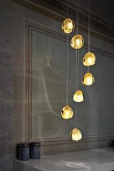 Mizu suspension 7 gouttes de cristal doré. Terzani. Mizu suspension 7 gouttes de cristal doré. Terzani.