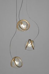 Pug triple ball pendant in clear glass and raw brass. Terzani. 