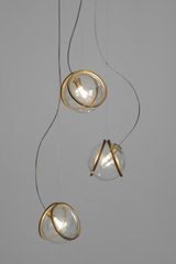 Pug suspension triple boules en verre transparent et laiton brut. Terzani. Pug suspension triple boules en verre transparent et laiton brut. Terzani.